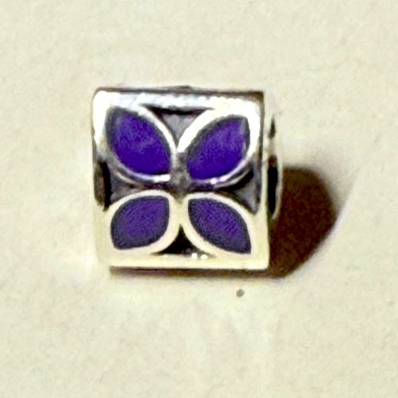 Pandora Jewelry - Pandora purple enamel four petal flier. On all three sides